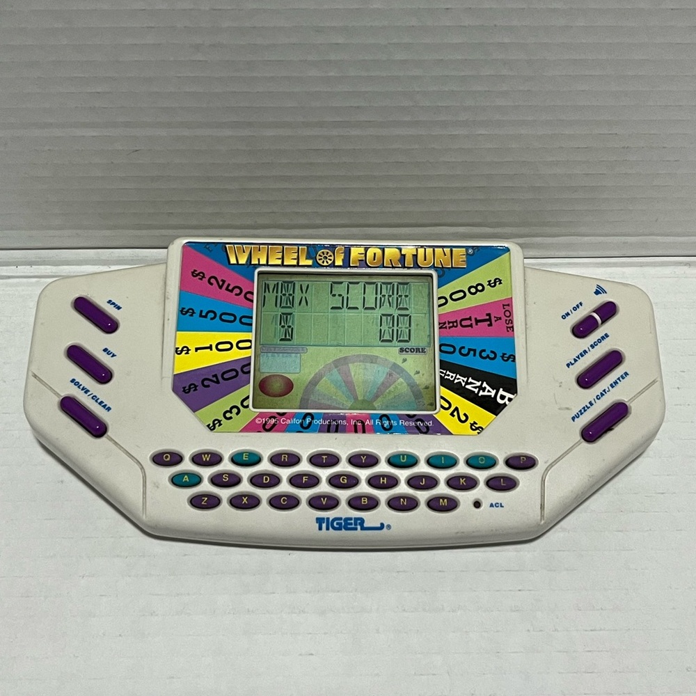 Vintage wheel of Fortune handheld game from Tiger electronics 1995/1996
